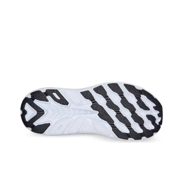 Running shoe outsole, white rubber with black traction pods and textured tread
