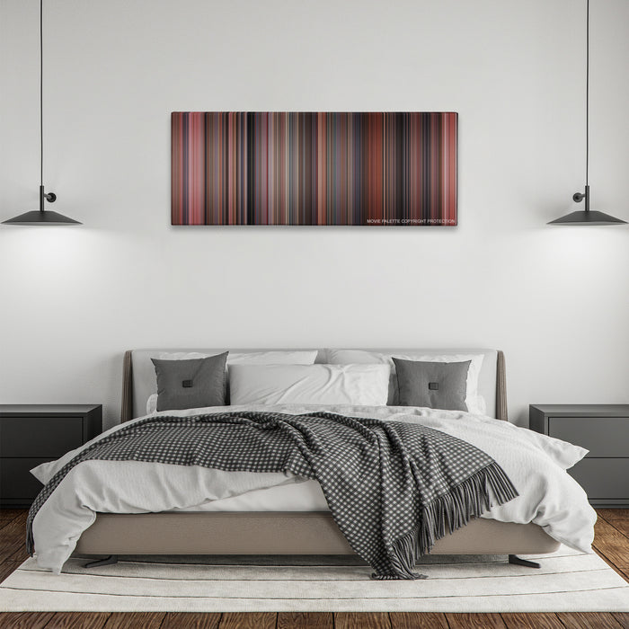 Home Alone color palette canvas above a bed, between two black pendant lamps