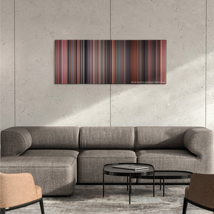 Home Alone color palette canvas on a concrete wall above a gray sectional sofa