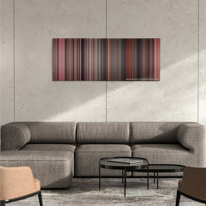 Home Alone color palette canvas on a concrete wall above a gray sectional sofa