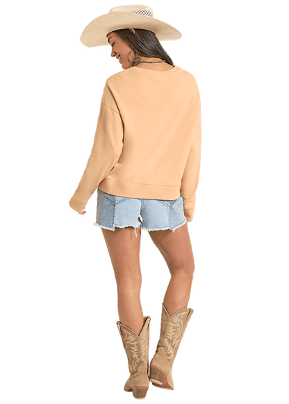 Woman in BW91T08105 sweatshirt, denim shorts, and cowboy boots