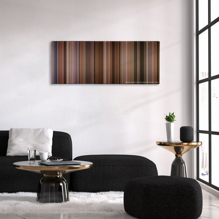 Jerry Maguire color palette canvas above a black sofa with a gold-topped table