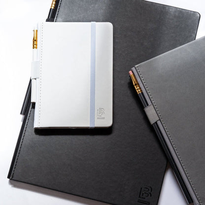 Blackwing Slate notebooks in white, grey, and black