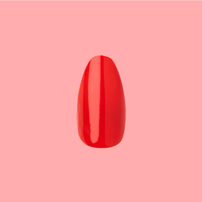 Lava - Press-On | Medium | Almond showing single medium almond false nail in vibrant spicy orange red polish on pink background