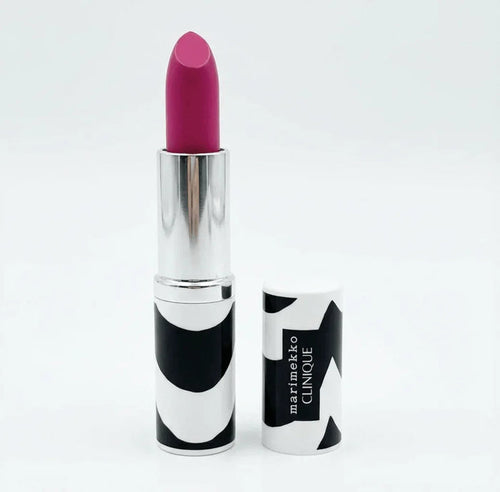 Pink lipstick in silver tube with bold black and white patterned cap, upright on white background