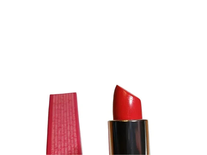 Red lipstick with textured pink cap on white background