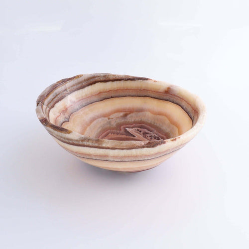 Mexican Onyx/Calcite Bowl 10" features warm amber tones and organic shape, showcasing unique hand-crafted design.