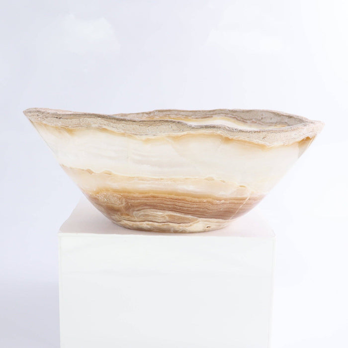 Mexican Onyx/Calcite Bowl 10" showcasing hand-carved amber and honey-toned banding and natural rim.