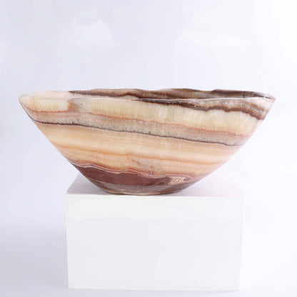 Mexican Onyx/Calcite Bowl 10" showcasing warm amber tones and organic shape, ideal for home decor.