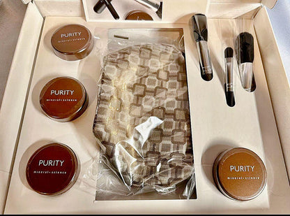Mineral powder foundation set with Purity mineral science jars, brushes, and patterned pouch