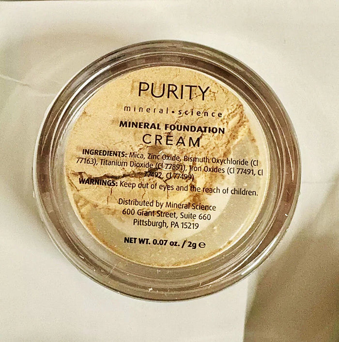 Purity mineral foundation cream in a round jar, medium shade, close-up view of label.