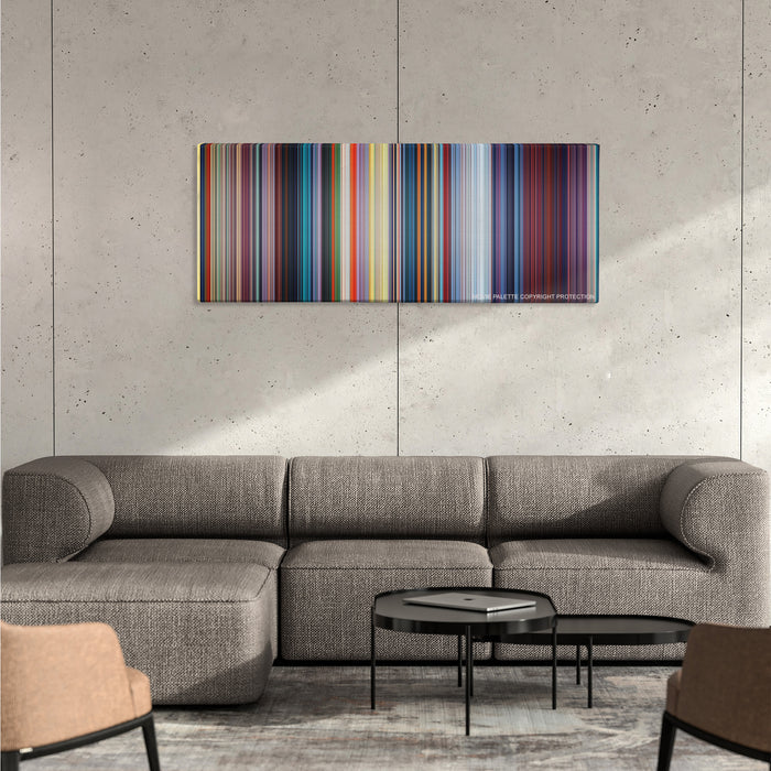 Mulan color palette canvas on a concrete wall above a gray sectional sofa