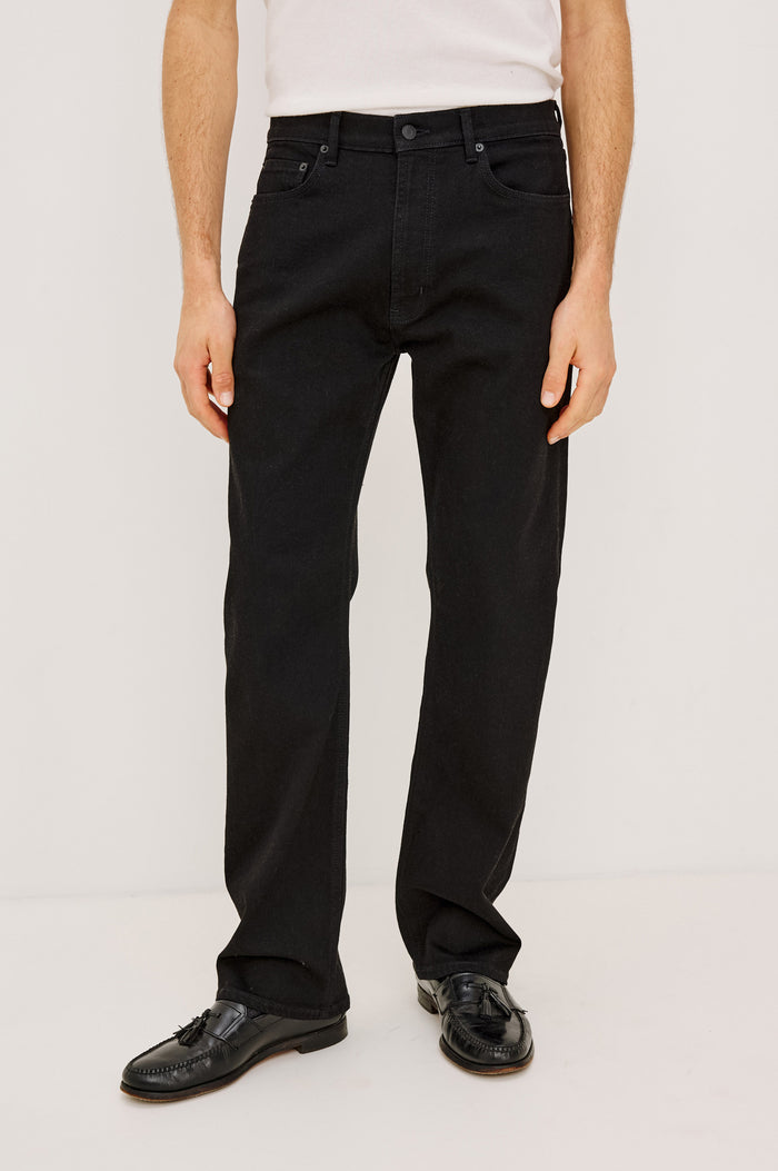 Nash Straight Leg Jean in Rigid Denim With Vintage-Inspired Button Fly in Dark Black Colorway - Front view featured on model.