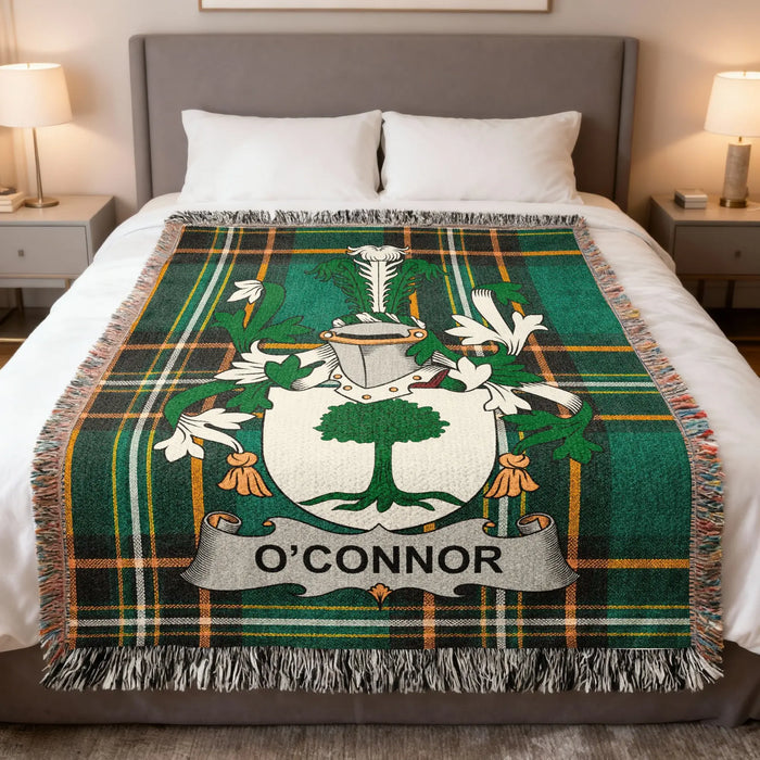 O'Connor family crest woven blanket draped across a bed.