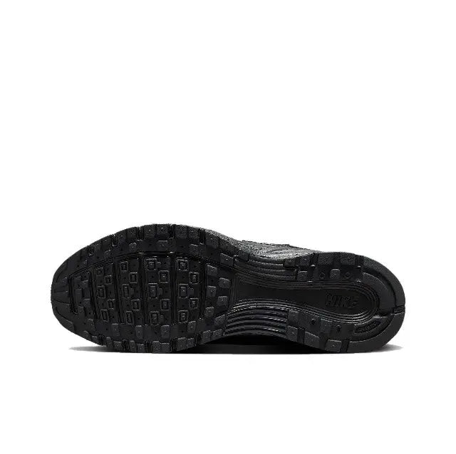Black sneaker outsole with traction tread and textured rubber pattern