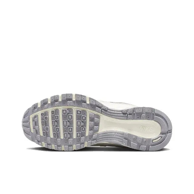Beige Nike P-6000 sneaker outsole with tread pattern and cushioned heel