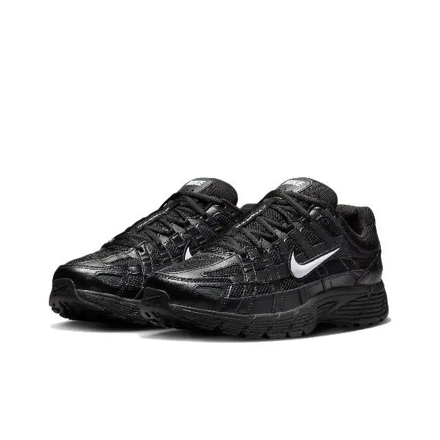 Black low-top Nike sneaker with lace-up closure and swoosh logo