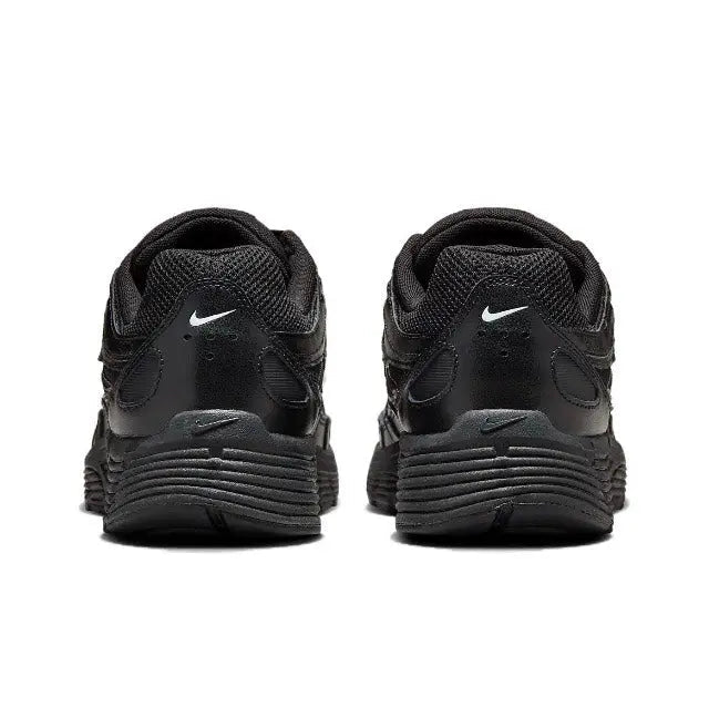 Black Nike sneaker heels with cushioned midsole and heel tab detailing