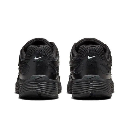 Black Nike sneaker heels with cushioned midsole and heel tab detailing