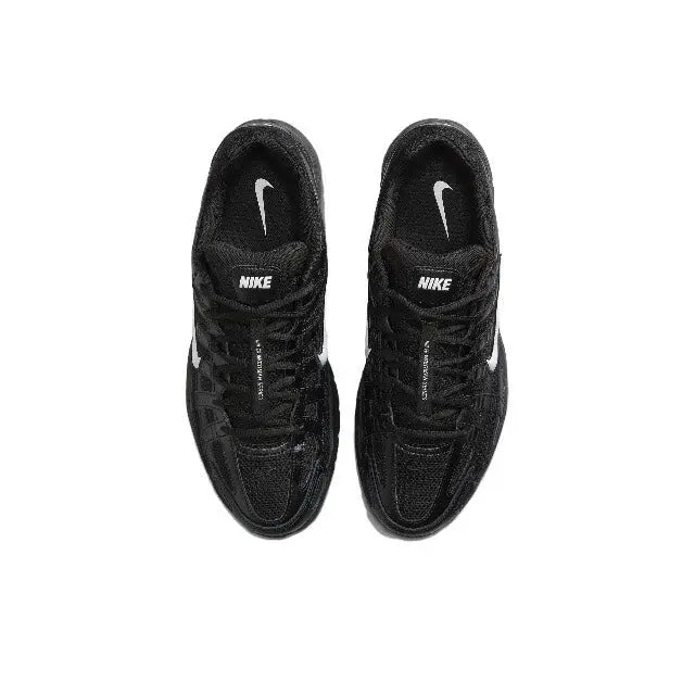 Black Nike sneakers showing front toe and laces with Swoosh logos