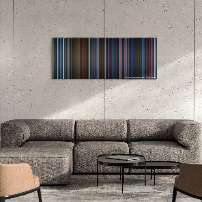 Pacific Rim color palette canvas on a concrete wall above a gray sectional sofa
