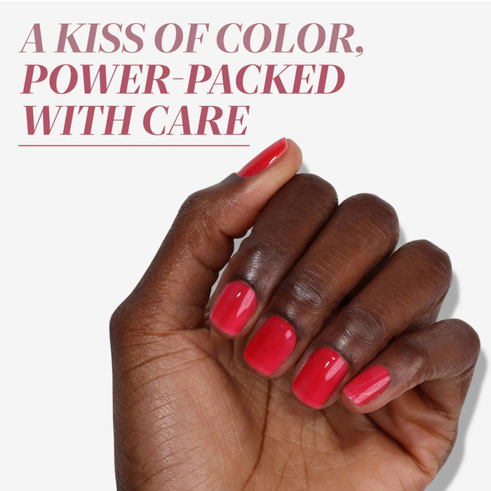 A dark-skinned hand shows neatly manicured nails in glossy bright red, set against a plain background. Above, text reads: "Perfecting Nail Veil #8 by LONDONTOWN: Power-packed care with a kiss of color.
