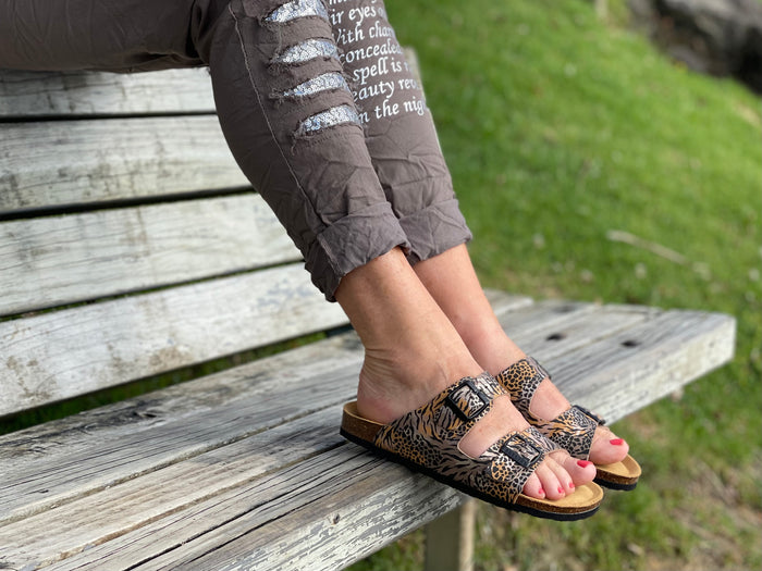 European made women's sandals. comfortable contoured cork footbed slide sandals. Quality leather sandals. In leopard animal print