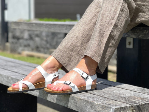 Quality European women's sandals. Made in Spain contoured cork footbed and rubber sole. Slide style sandal with toe ring that comes in white.