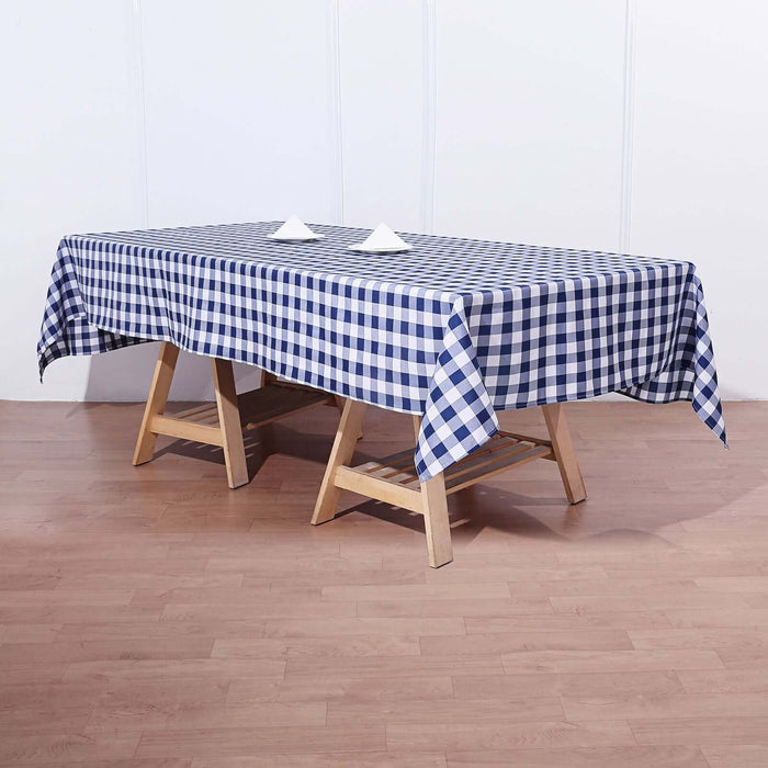 Blue and white checkered tablecloth on a wooden table.