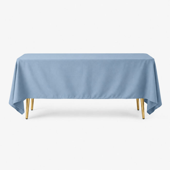 Dusty blue 72"x120" wrinkle-resistant polyester tablecloth on a wooden table.