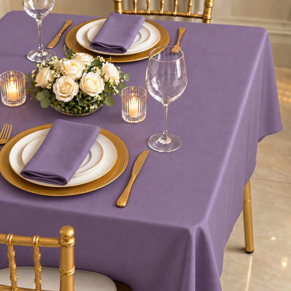 Violet amethyst polyester square tablecloth on an elegantly set dining table.