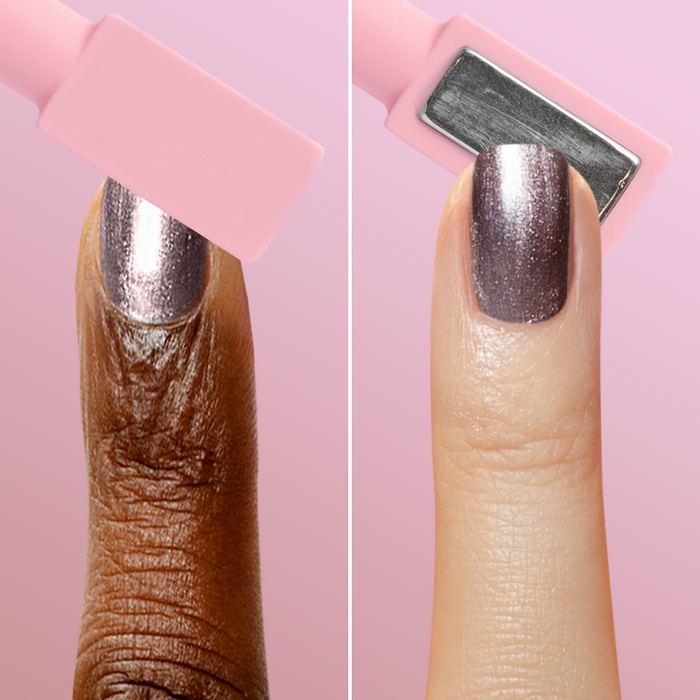 Close-up of two fingers showing metallic polish and magnet wand creating a velvet effect with Pretty Neutral Velvet Duo manicure.