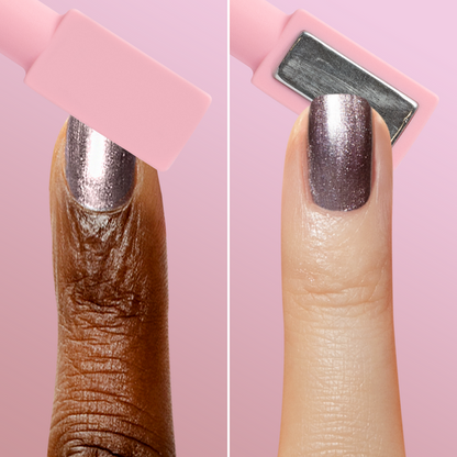 Close-up of two fingers showing metallic polish and magnet wand creating a velvet effect with Pretty Neutral Velvet Duo manicure.