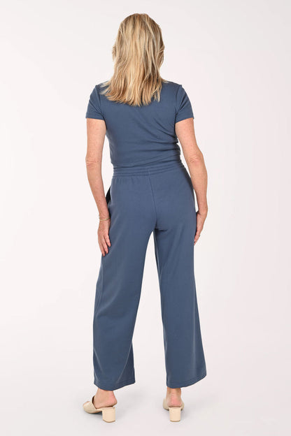 Woman wearing a two piece lounge set in blue