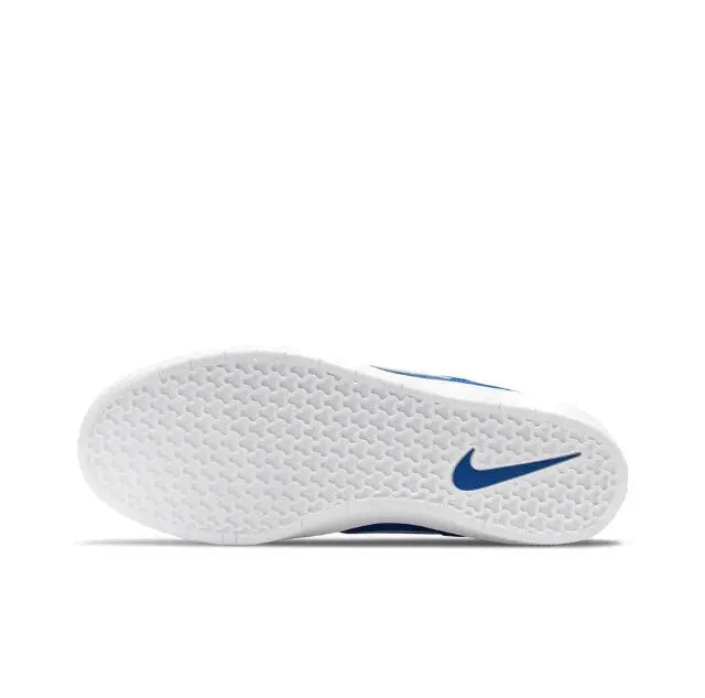 Blue low-top skate sneaker outsole with textured tread and Nike Swoosh on heel.