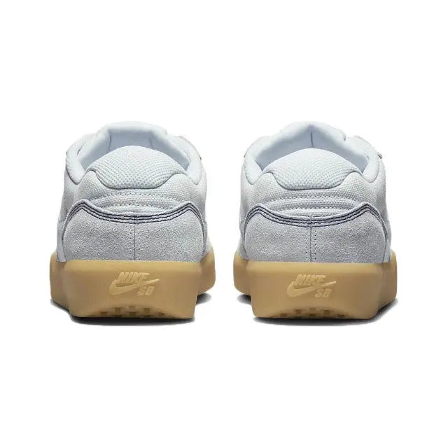 Grey skate shoes, rear view pair, gum heel soles with Nike SB branding