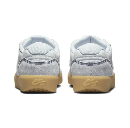 Grey skate shoes, rear view pair, gum heel soles with Nike SB branding