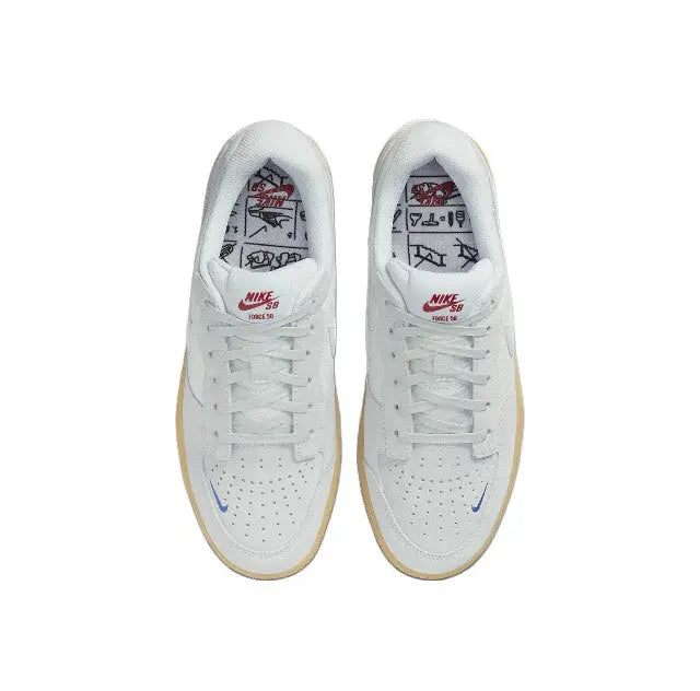 Grey skate shoes with white insoles showing Nike SB and red graphic