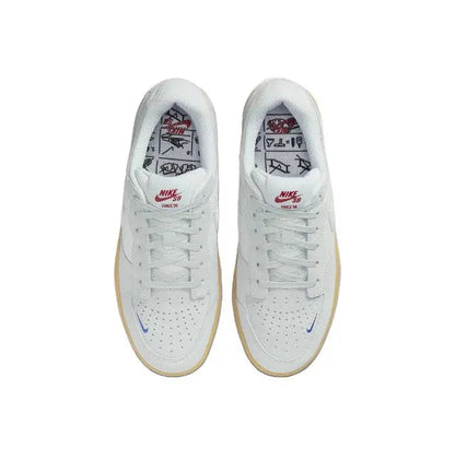 Grey skate shoes with white insoles showing Nike SB and red graphic