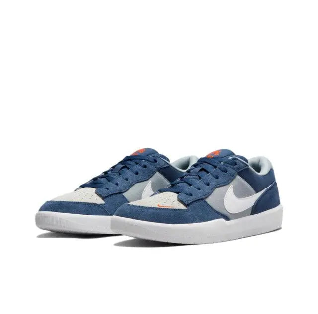 Blue and white low-top skate sneakers, lace-up front with gray toe cap and swoosh