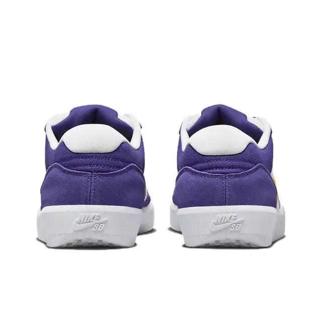 Back view of purple low-top sneakers with white heel tab