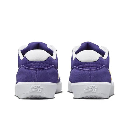 Back view of purple low-top sneakers with white heel tab