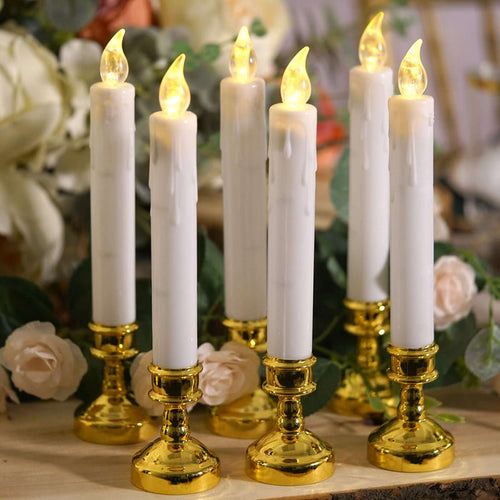 Set of six LED candle holders with gold bases and flickering flame-like tops.