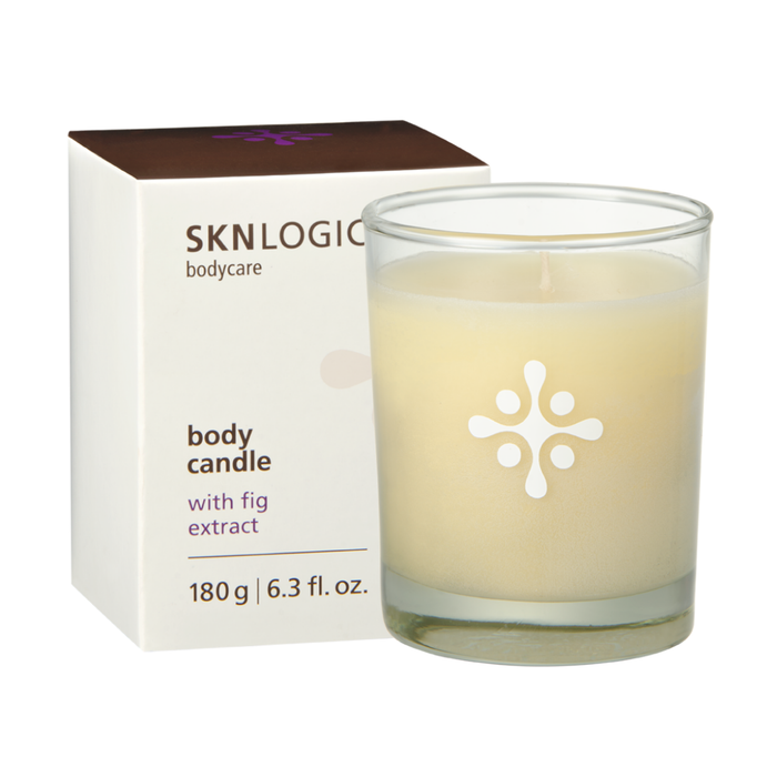 SKN071A SKNLOGIC Fig Soy Body Massage Candle | A SKNLOGIC body candle in a clear glass jar with pale cream wax and a white flower-like logo, shown next to its white box with brown and purple text.