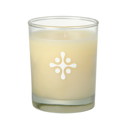 SKN071A SKNLOGIC Pineapple Soy Body Massage Candle | A cream-colored wax candle in a clear glass jar with a white geometric flower-like logo printed on the front, set against a plain white background.