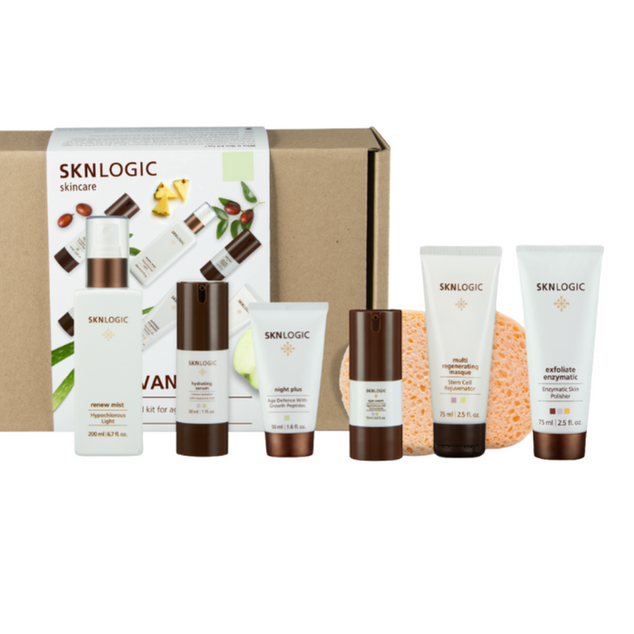 SKNKIT008 SKNLOGIC Age Defense Advance Retail Kit | SKNLOGIC skincare products including bottles and a box on a white background