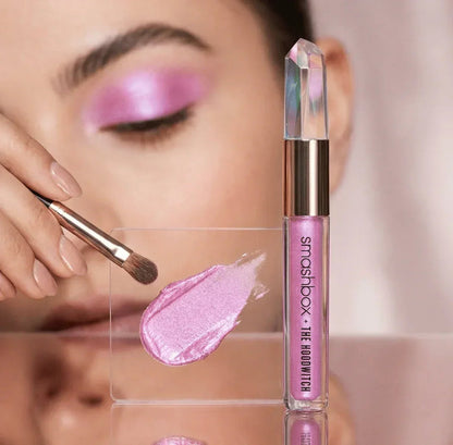 Shimmer pink eyeshadow applied on eyelid with brush, Smashbox liquid eyeshadow packaging