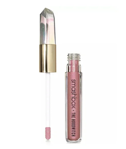 Pink shimmer eyeshadow liquid with crystal-inspired wand and gold cap
