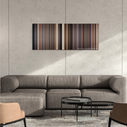 Spaceballs color palette canvas on a concrete wall above a gray sectional sofa