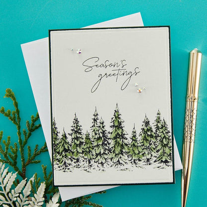 Spellbinders - BetterPress Letterpress Press Plates & Die Set - Seasons Greetings Evergreens. A set of two press plates and one thin metal cutting die. The largest press plate is a line of beautiful evergreen trees which makes a beautiful border. Available at Embellish Away located in Bowmanville Ontario Canada. Example by brand ambassador.